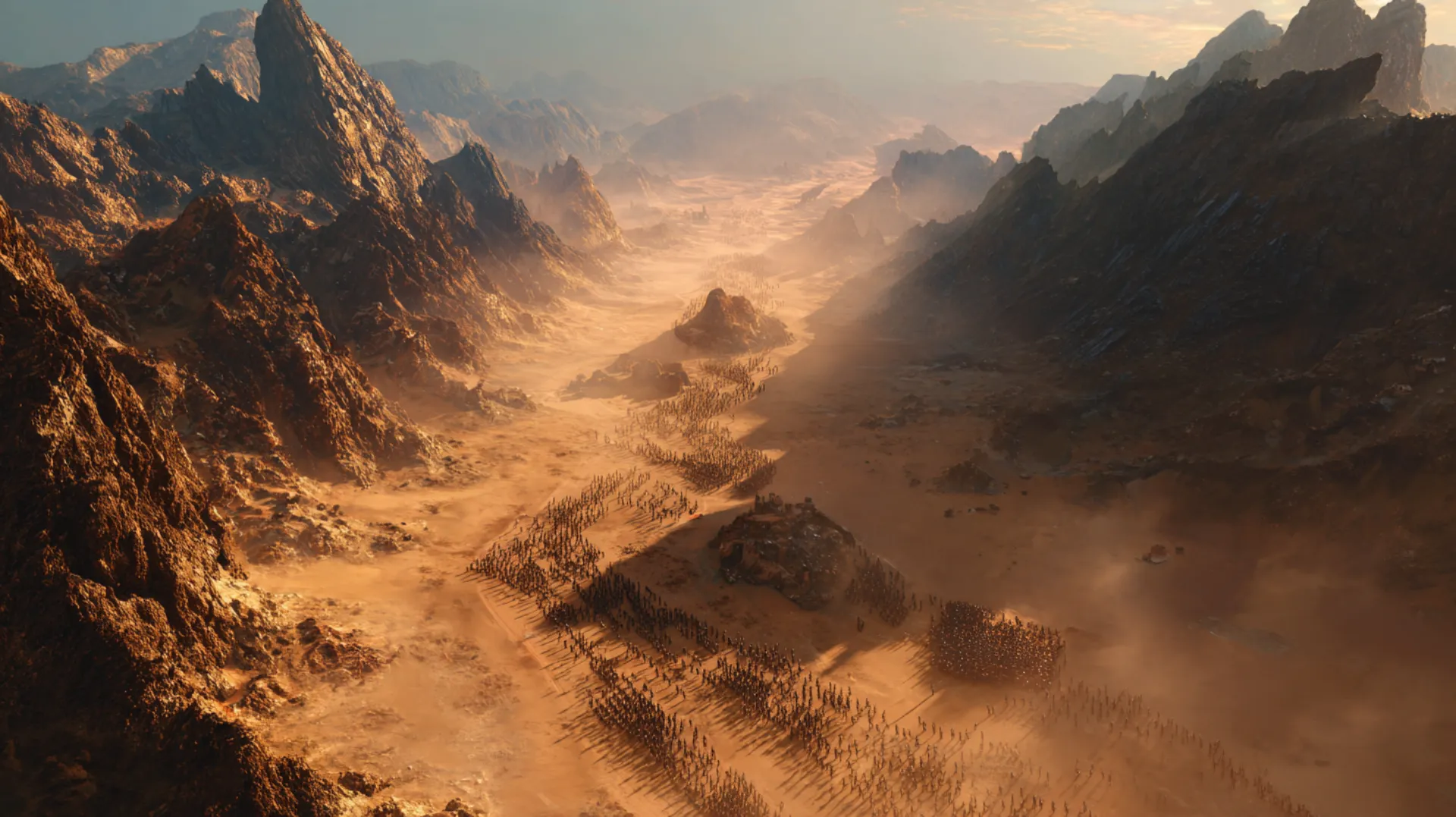 Aerial view of a narrow desert plain flanked by dark volcanic mountains at golden hour, with dust rising and a small rocky hill visible in the center gap